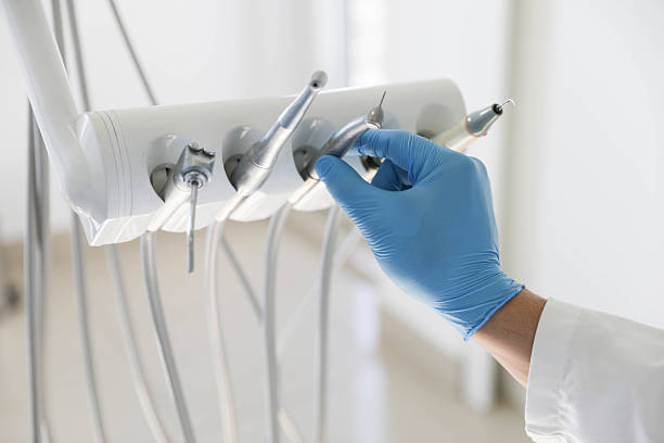 Professional Tooth Extraction technician working in James City County County, VA
